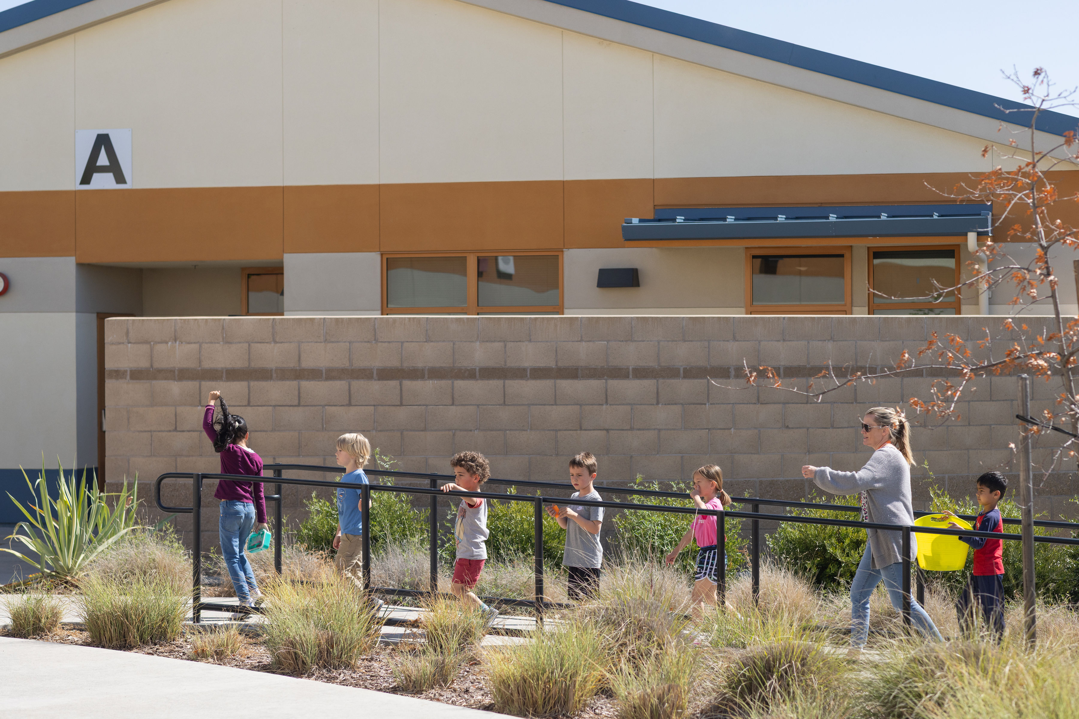 Quarry Trail Students walking on campus.